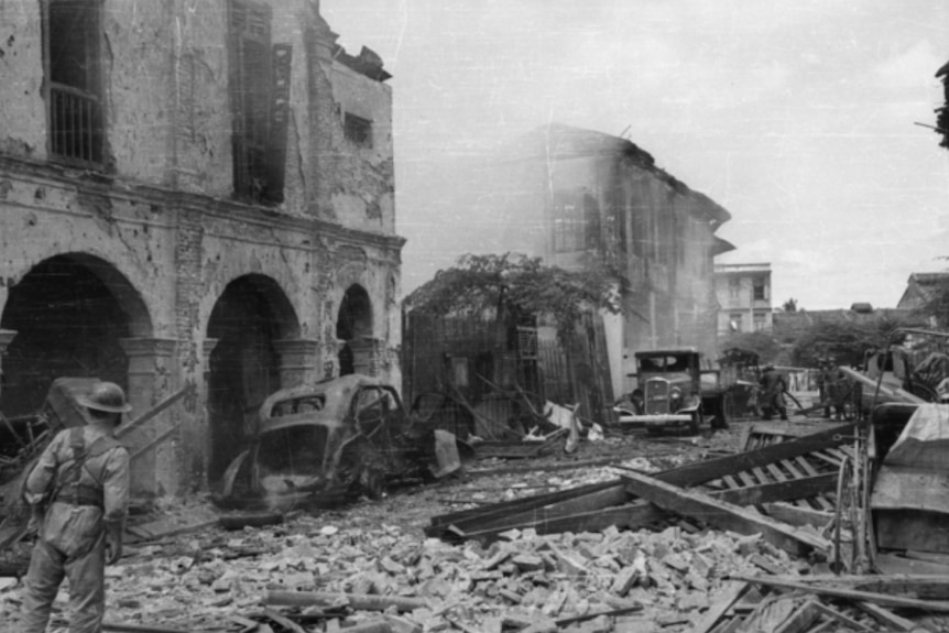 A black and white photo of bombed out buildings