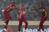 West Indies' Samuel Badree is congratulated after dismissing Pakistan's Shoaib Malik.