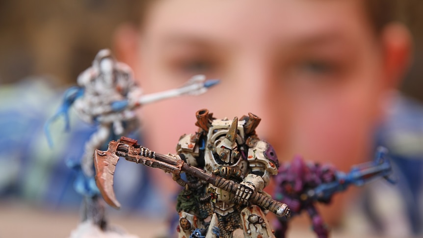 Samuel Perks with one of his favourite Warhammer characters, Typhus