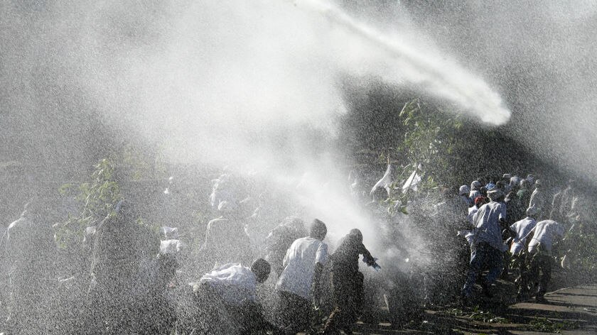 Kenyan police use teargas and water cannons against several hundred anti-government protesters in Nairobi.