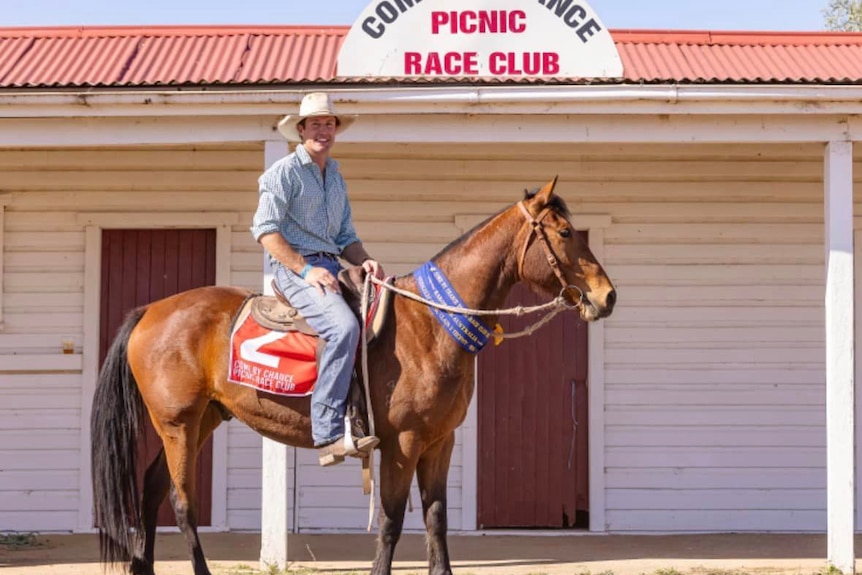 Come By Chance farmer Charlie Friend on his horse