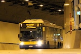 A bus exits the Northern Busway tunnel at the Lutwyche Bus Station.