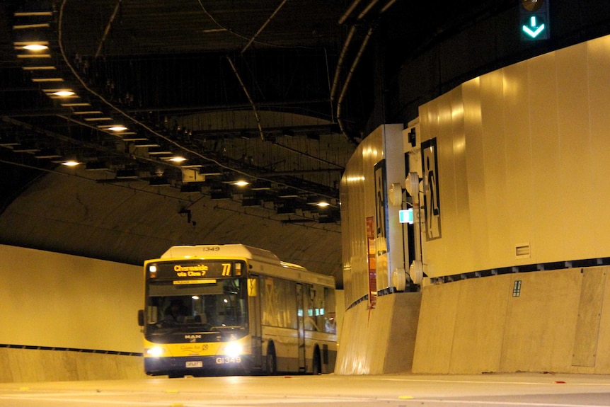 A bus exits the Northern Busway tunnel at the Lutwyche Bus Station.