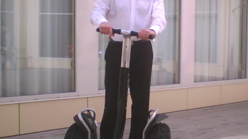 Tas Premier David Bartlett demonstrates a Segway scooter.