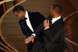 Will Smith appears to hit Chris Rock onstage during the Oscars.