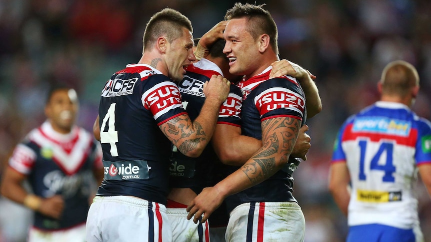 Shaun Kenny-Dowall (L) and the Roosters celebrate a try against Newcastle in the preliminary final.