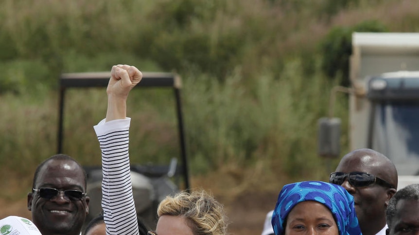 Madonna celebrates after laying the first stone at the site of her Raising Malawi Girls Academy.