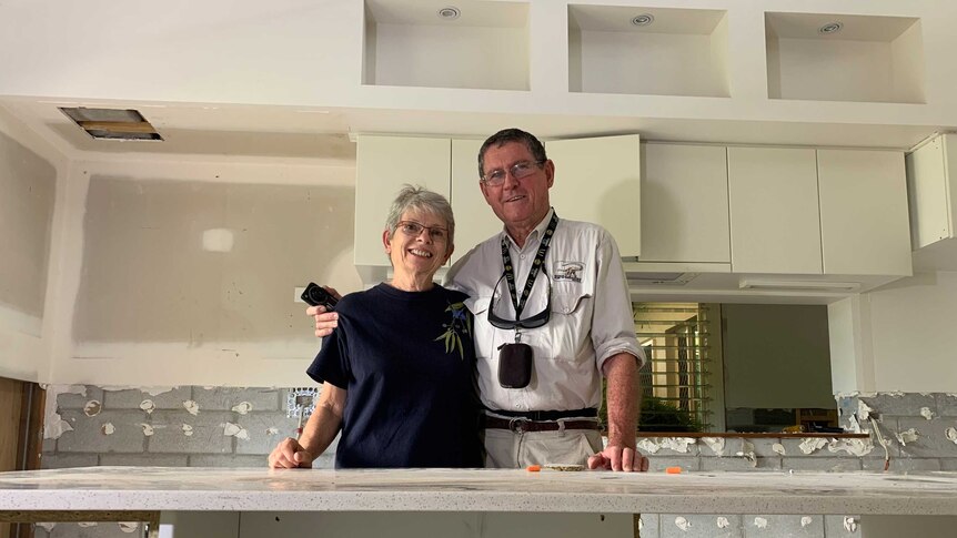 Sharryl and Michael Whiting stand in the kitchen of their home. The property is undergoing extensive repair work.
