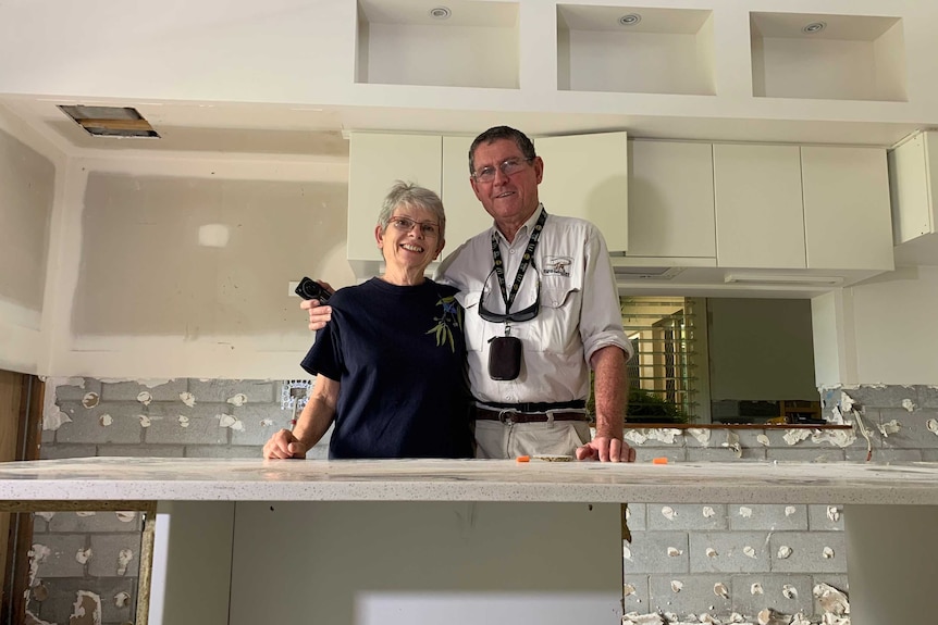 Sharryl and Michael Whiting stand in the kitchen of their home. The property is undergoing extensive repair work.