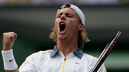 Lleyton Hewitt celebrates winning a point against Justin Gimelstob