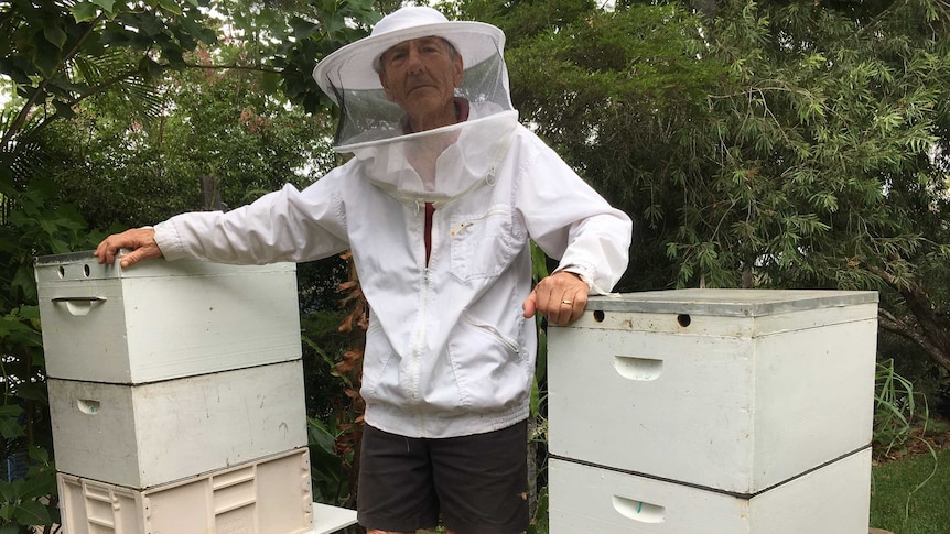 Bert Livingstone and two of his beehives