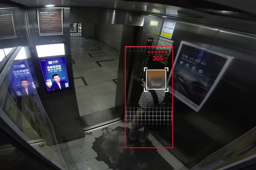 Liu Hu steps into an elevator.