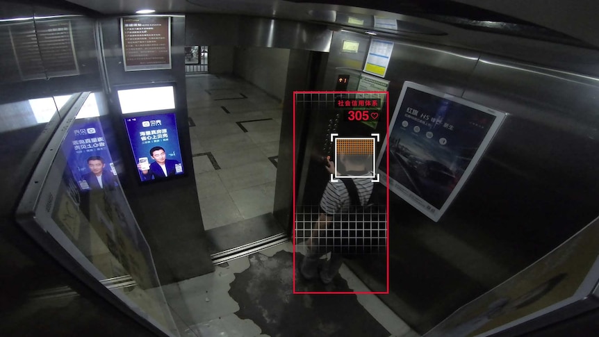 Liu Hu steps into an elevator.