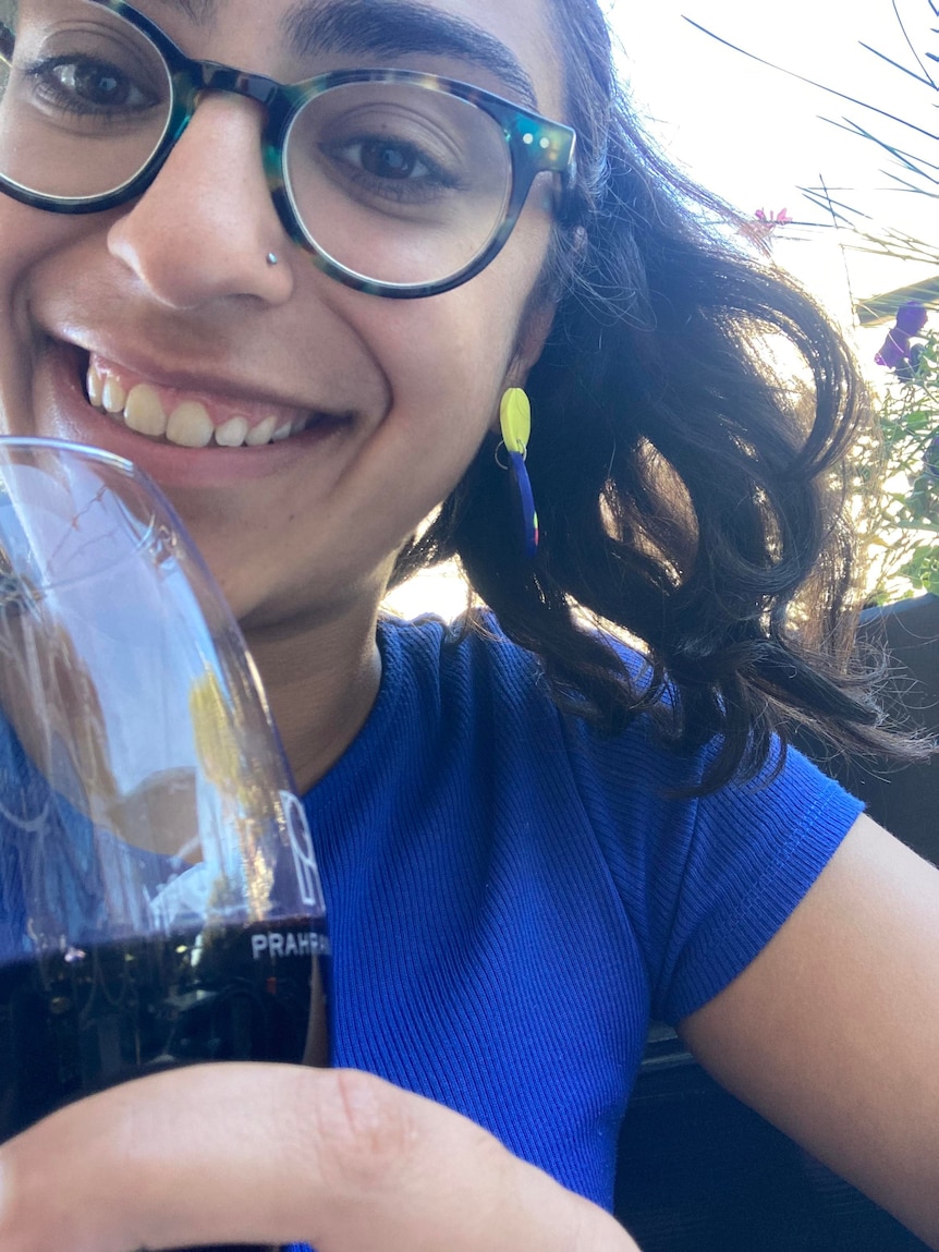 Ridhima on her solo pub date, with a glass of red wine.