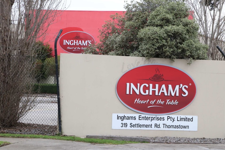 A large sign in front of a red building says 'Ingham's Heart of the Table'.