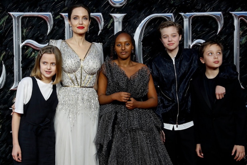 Angelina Jolie poses with four of her children at a movie premiere.