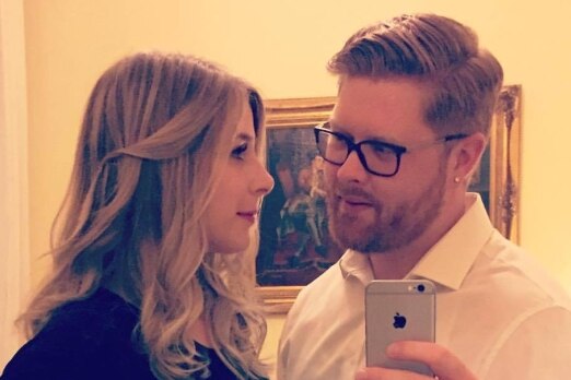 Tyler Ferguson takes a selfie photo of he and Christine Archibald.