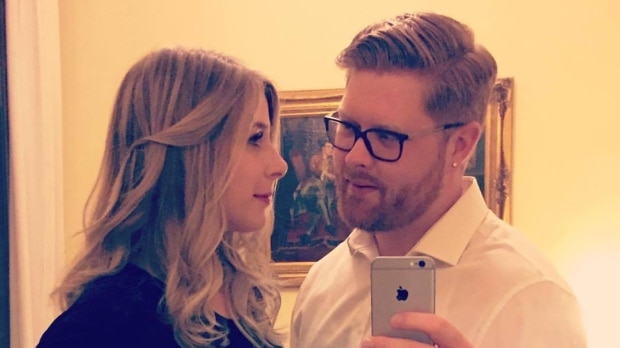 Tyler Ferguson takes a selfie photo of he and Christine Archibald.