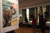 Visitors inspect items on display at the Australian War Memorial.