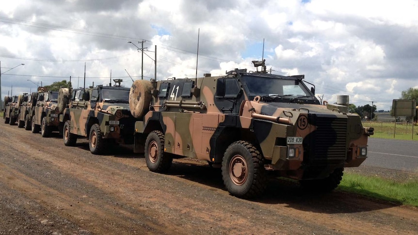 Army vehicles on their way to the flood-affected towns of Roma and Mitchell