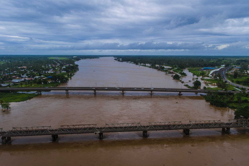 Aerial shot of a river that has burst its banks in Fiji.