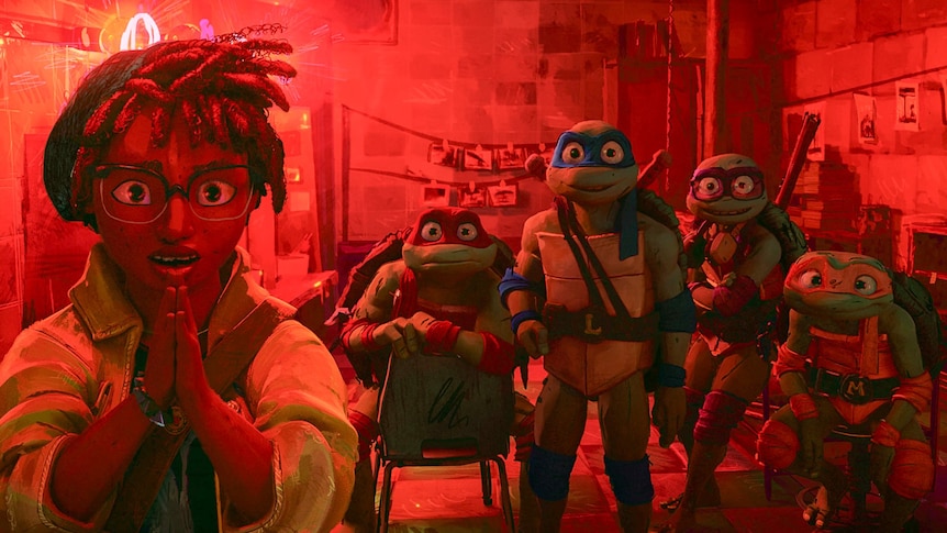 A film still from a cartoon showing a girl with glasses and four ninja turtles standing in a red lit room