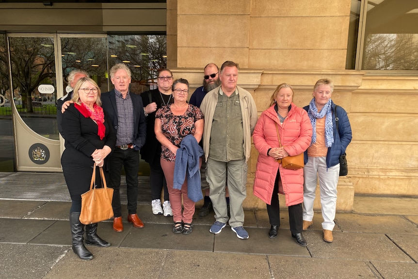 A group of people outside a court building