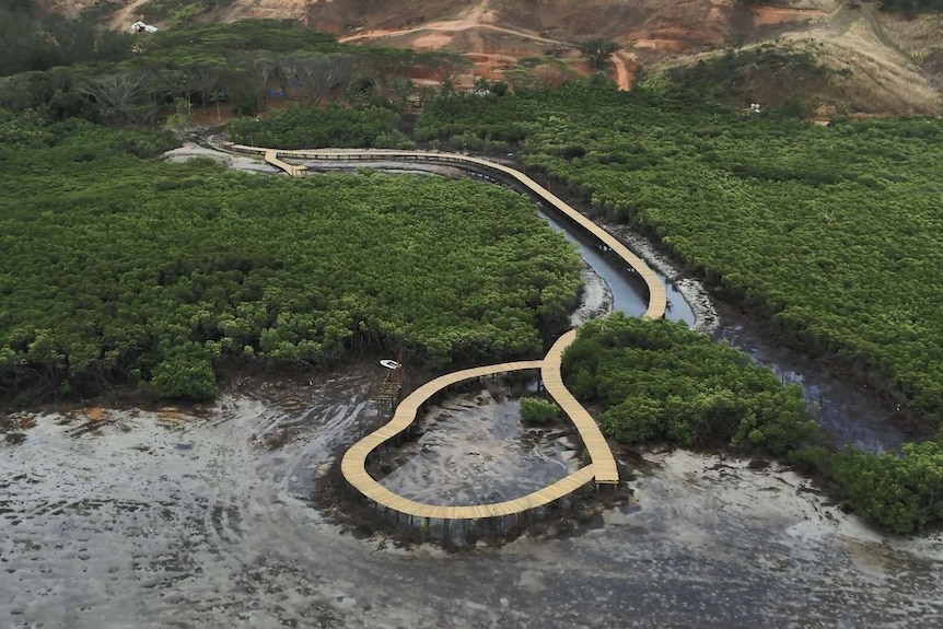 A walkway is built between mangroves and on the shoreline of Malolo Island, Fiji, at this under-construction resort.