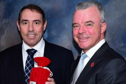 Brian Freeman and Brendan Nelson with the Roll of Honour canister