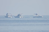 Chinese Coast Guard boats close to the floating barrie