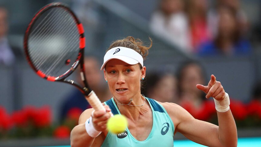 Australia's Sam Stosur hits a return against Spain's Carla Suarez Navarro at the Madrid Open.