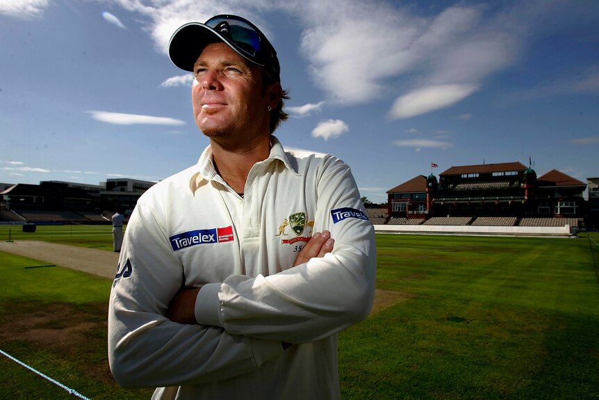 Shane Warne poses for a portrait on the pitch at Old Trafford