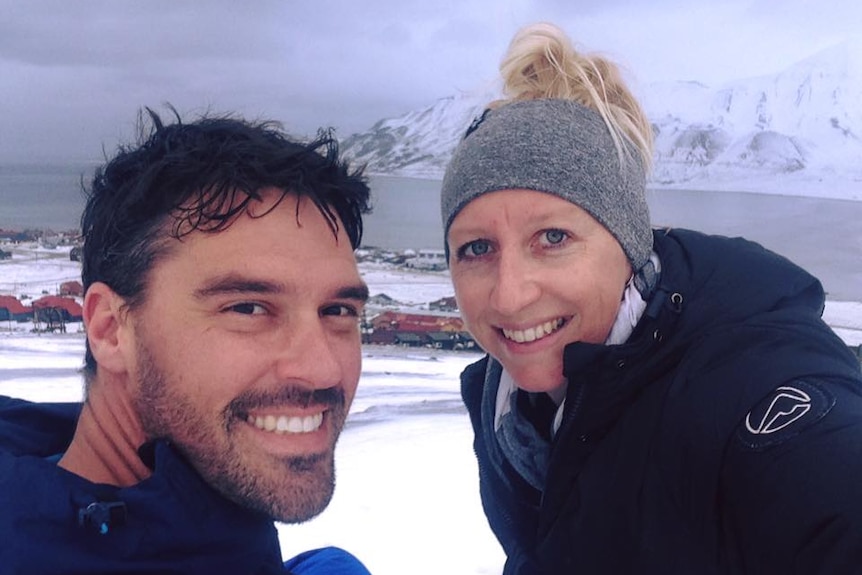 Carly and Michael take a selfie for a story about skipping major tourist sites for a unique travel experience