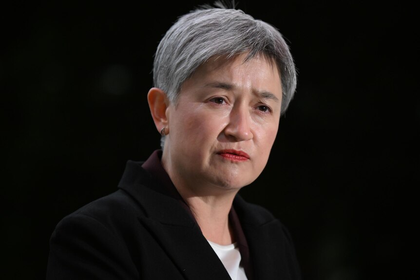 Senator Penny Wong with a serious expression. 