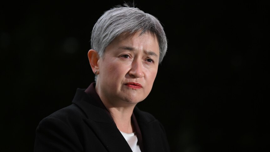 Senator Penny Wong with a serious expression. 