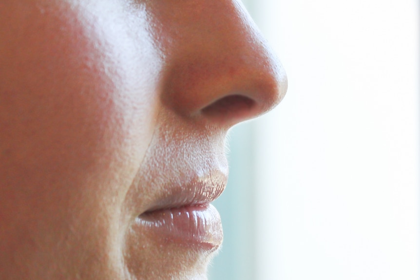 A close up of a lady's nose.