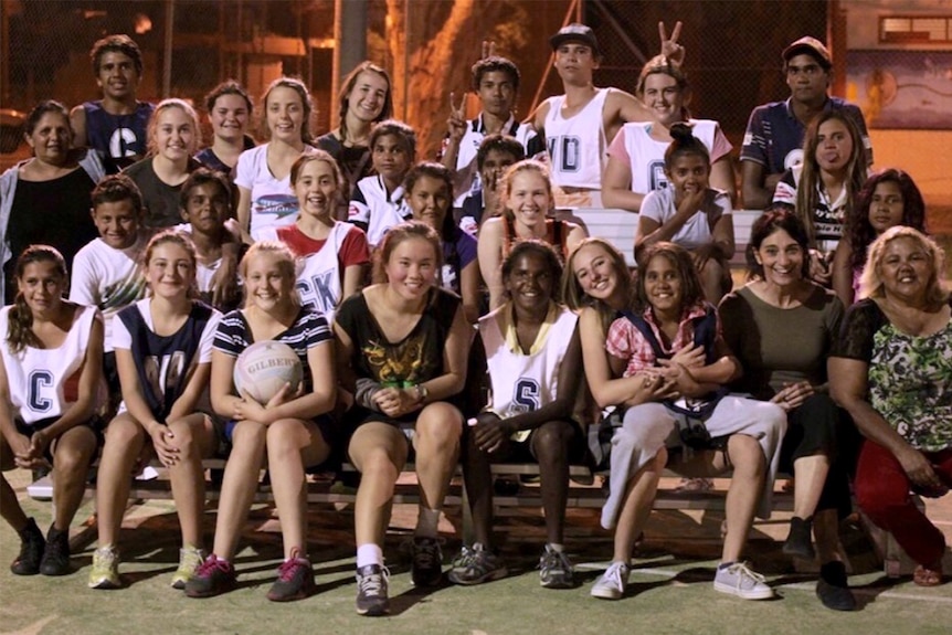 Sydney girls' netball team meeting Indigenous students in Brewarrina.