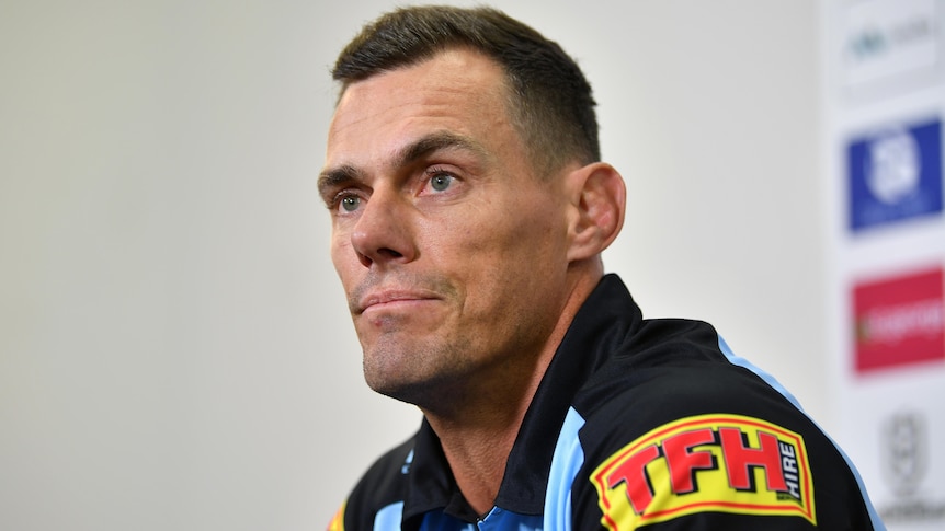 The Cronulla Sharks NRL coach waits for a question to be asked at a media conference.