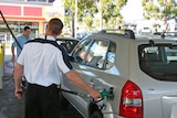 man filling car from petrol bowser