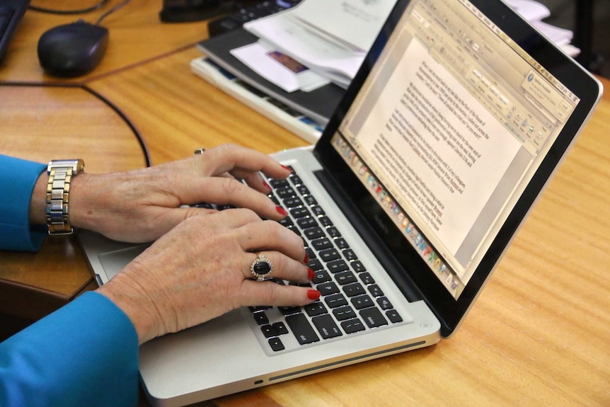 Pauline Hanson's hands on keyboard