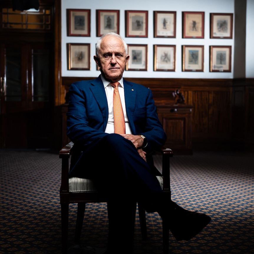 Malcolm Turnbull sits in a chair.