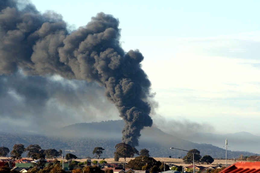 The Mitchell blaze sent a large plume of black smoke across Canberra homes.