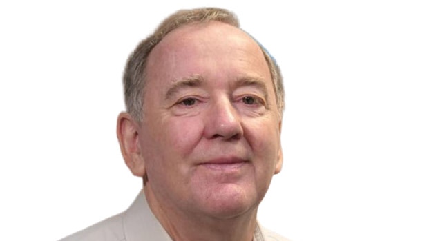 Liberal candidate Peter Killin, wearing a white shirt and looking at the camera.