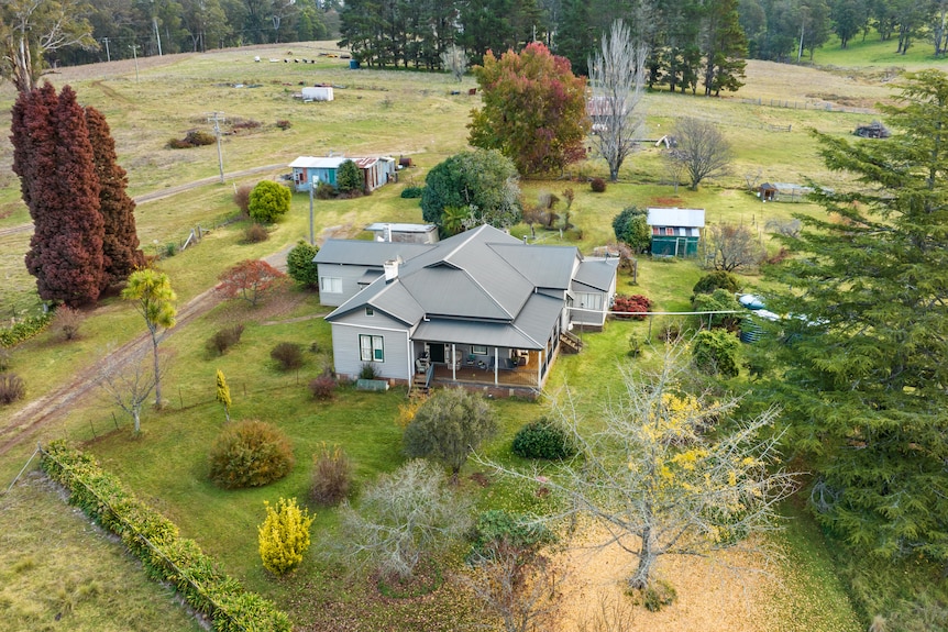 An aerial image of a house set on a farm.