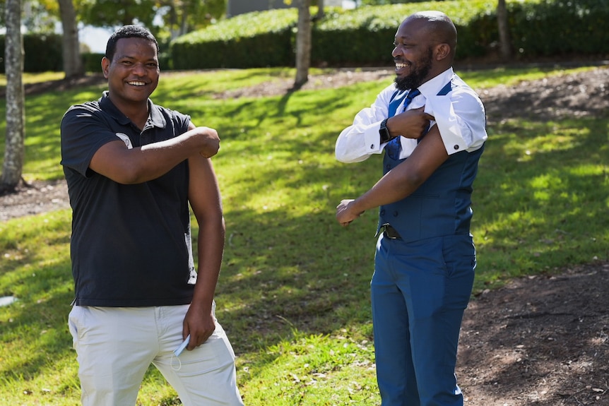 Blaise Itabelo and Girmay Gebermedhin after getting vaccinated