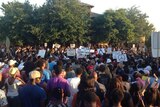 Hundreds march through McKinney, Texas, calling for the firing of a police officer who threw a bikini-clad teenage girl to the ground at a pool party disturbance.