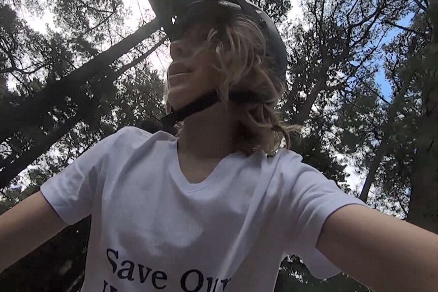 A GoPro shot of looking up at a mountain biker.