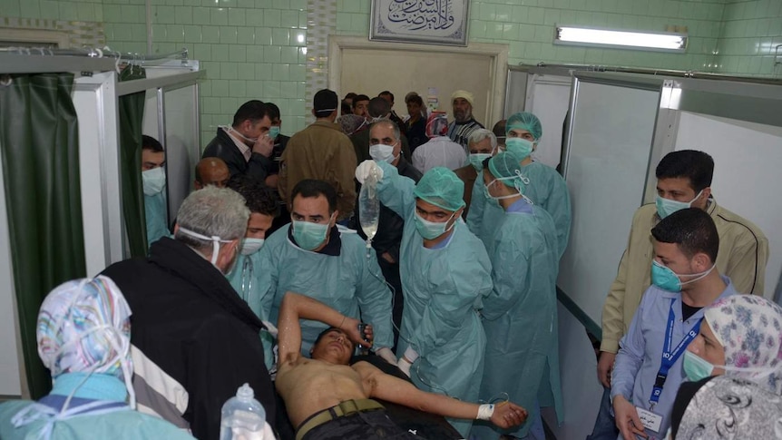 Hospital workers attend injured in alleged Aleppo chemical attack