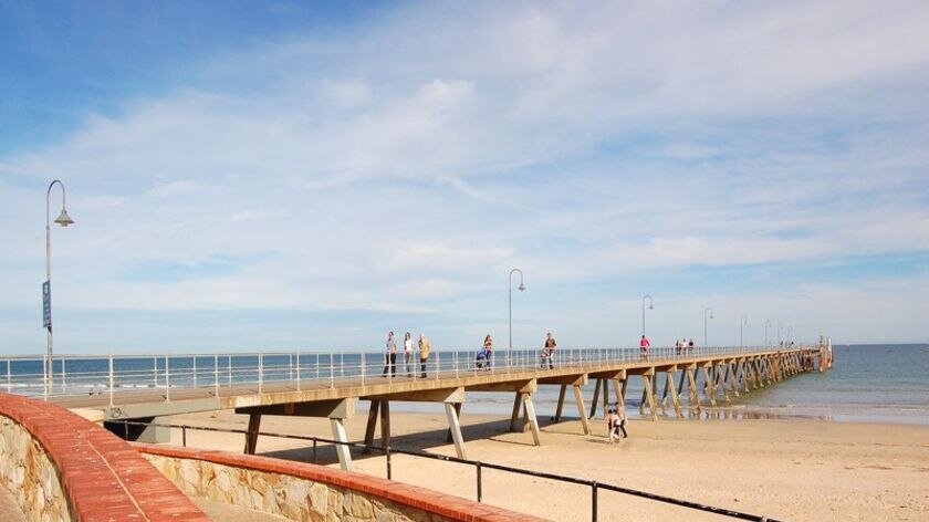 A man has died after jumping from the jetty at Glenelg