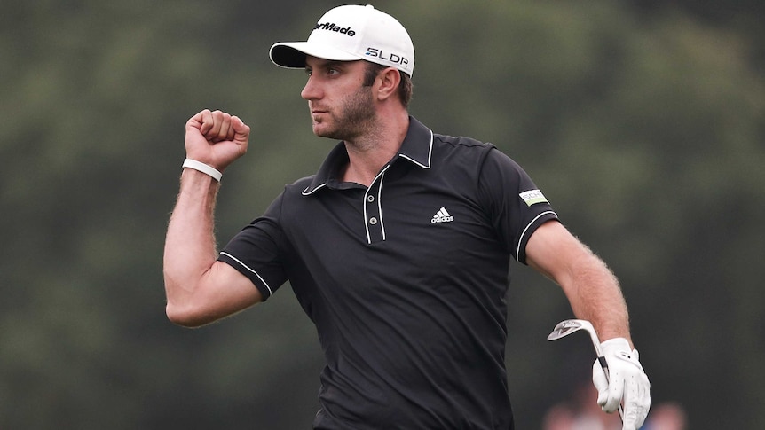Dustin Johnson celebrates after chipping in for eagle at the WGC Champions tournament.